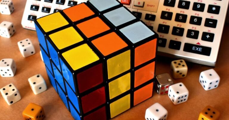 Autism logical thinking - A Rubik's cube surrounded by dices and a calculator